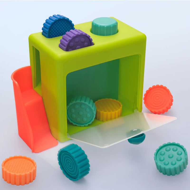 SASSY JUGUETE SENSORIAL PRESS AND PLAY COIN DROP